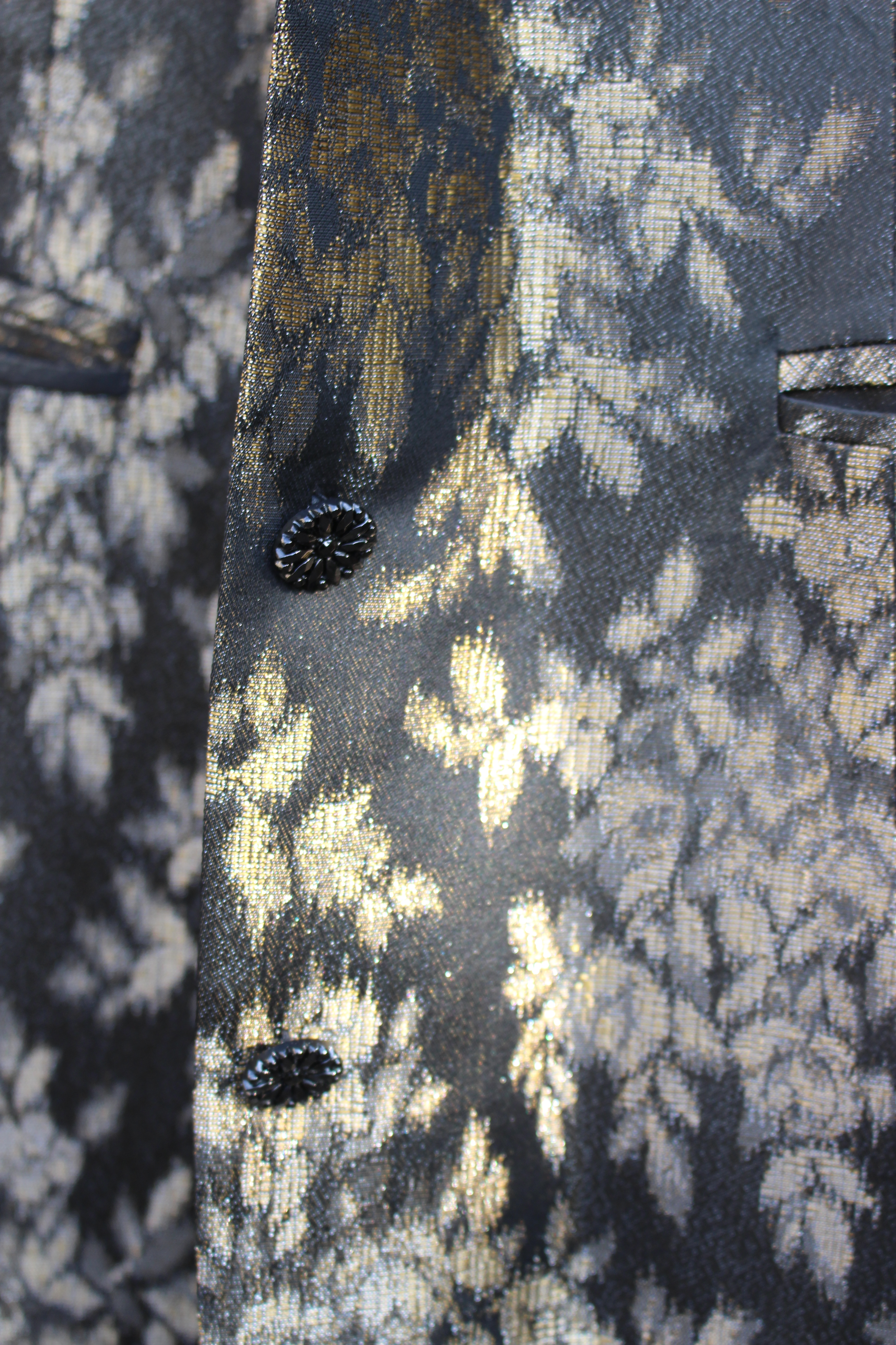Black and gold brocade jacket, showing detail of design