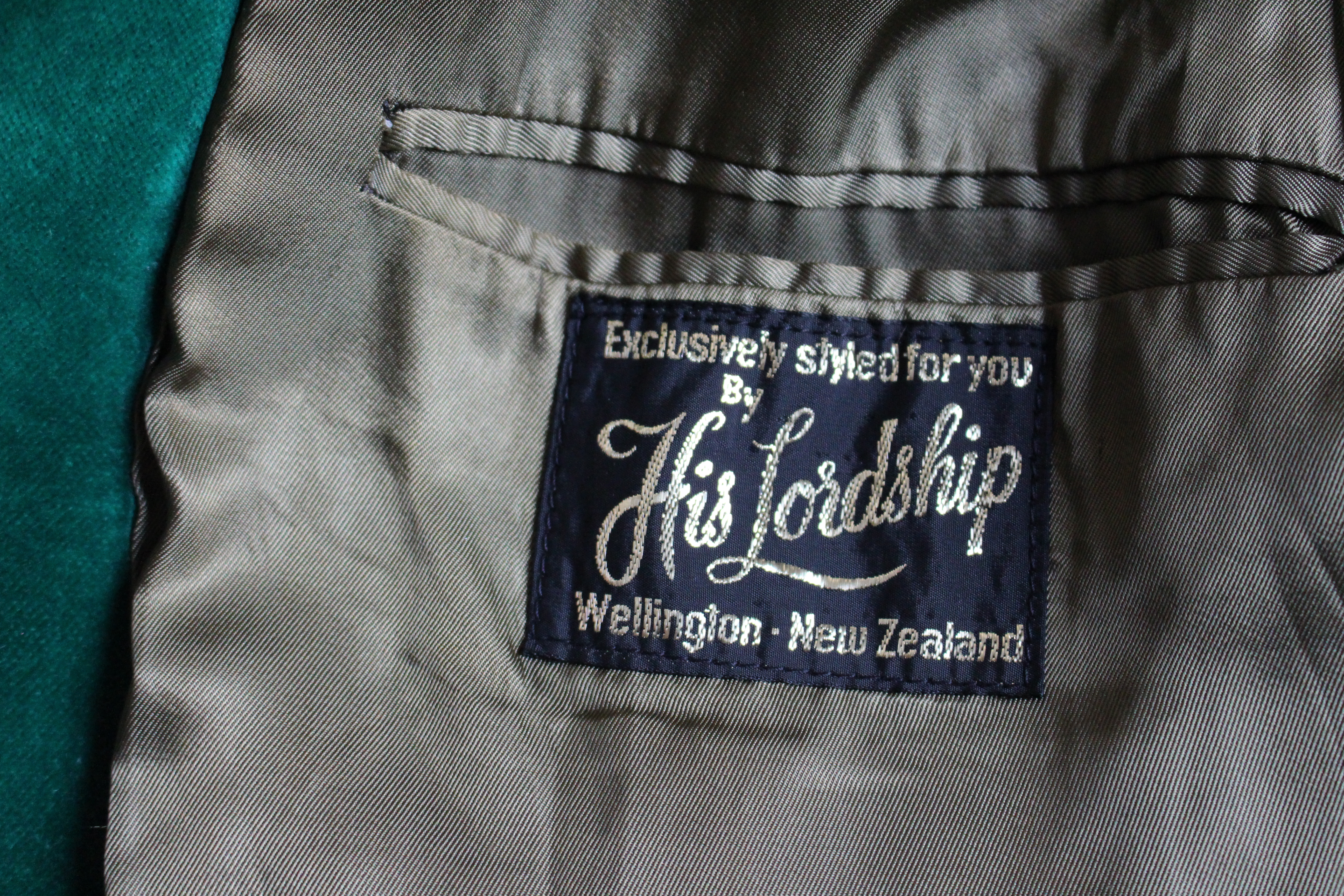 Label of light green velvet jacket, reading 'Exclusively styles for 
you by His Lordship, Wellington, New Zealand'