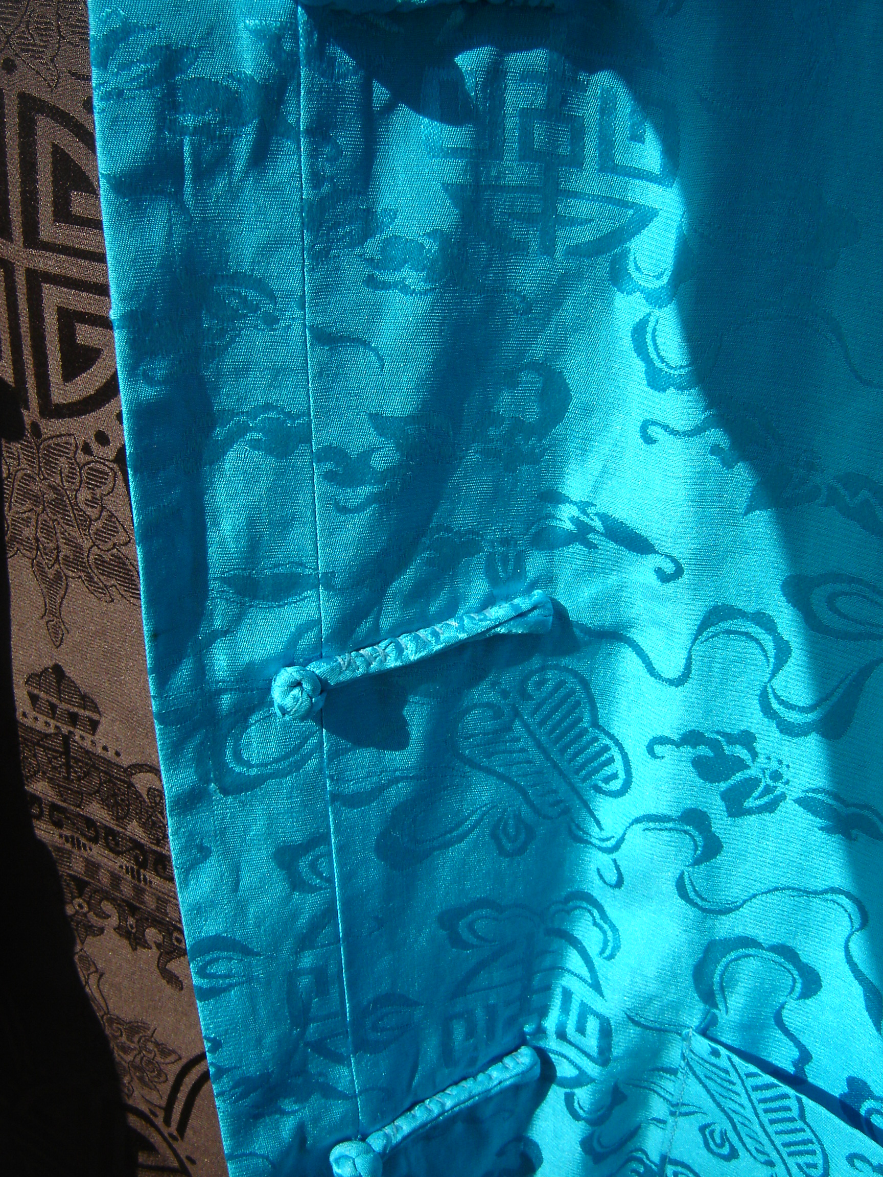 Intense blue and chocolate reversible silk Chinese jacket.