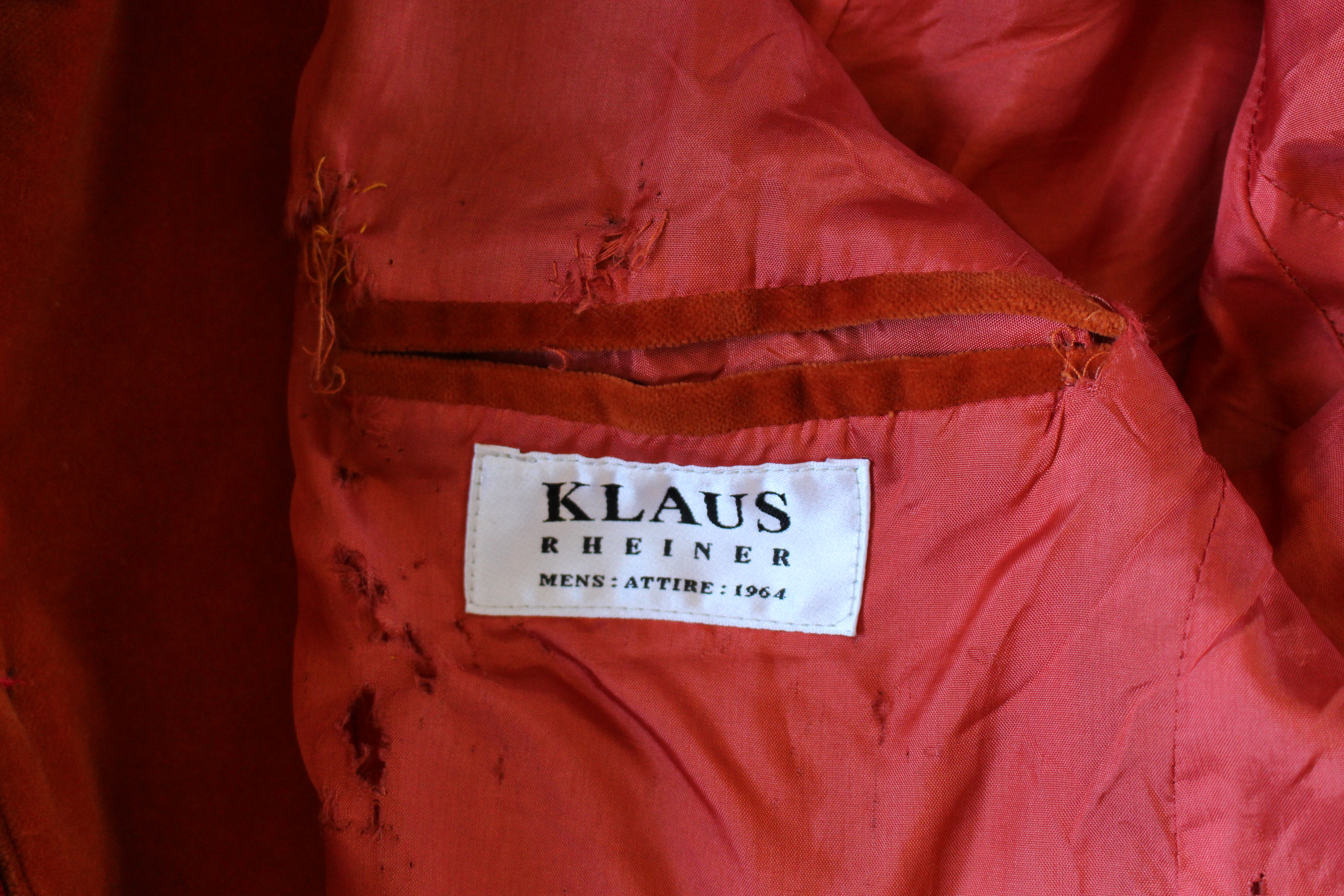 Klaus Rheiner orange velvet jacket, showing label