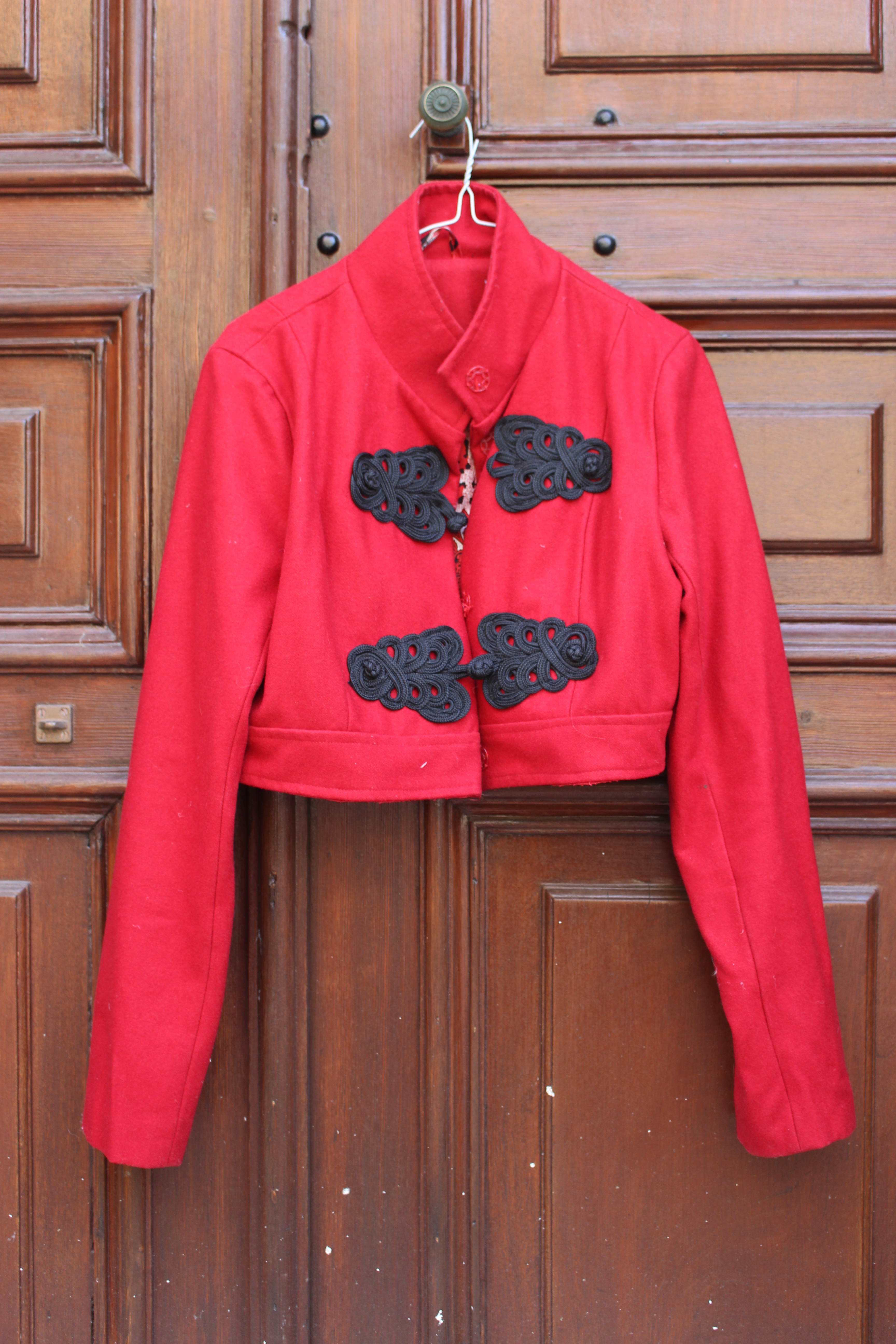 Red frogged reversible cropped jacket.