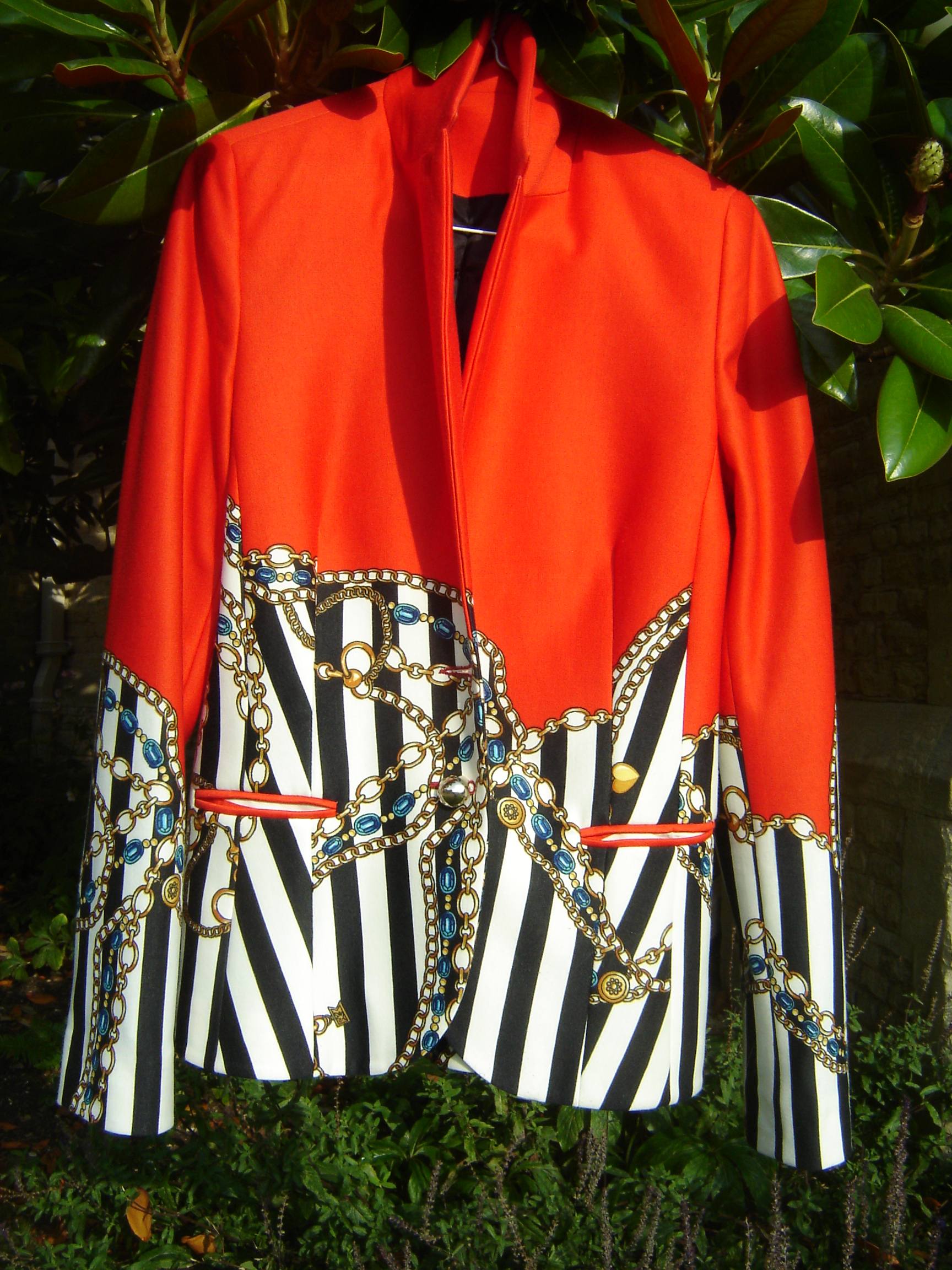 Red wool jacket with printed chain design.