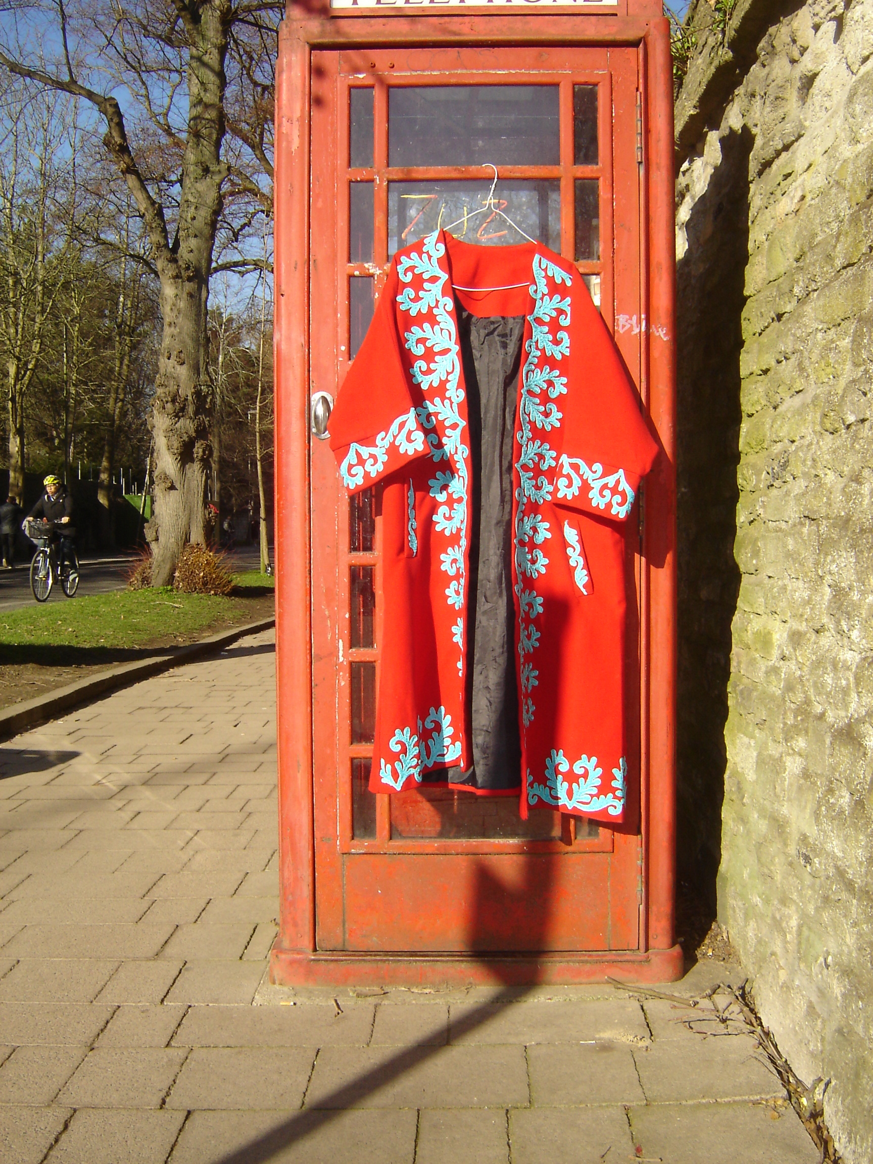 Splendid red full-length coat with turquoise embroidery