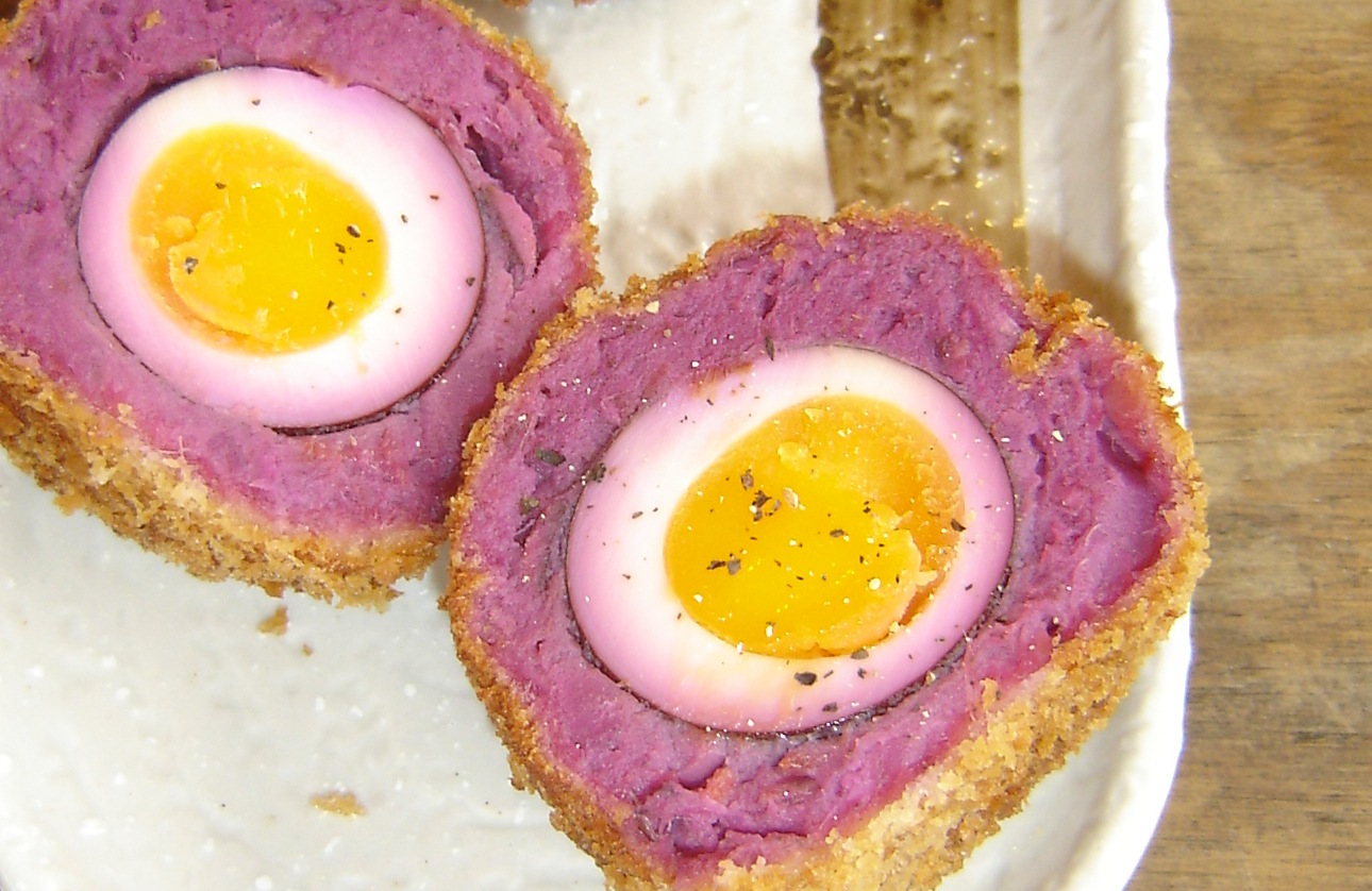Cranston Pickles bubble-and-squeak Scotch eggs. One is sliced open, 
showing the pink colour of the coating.